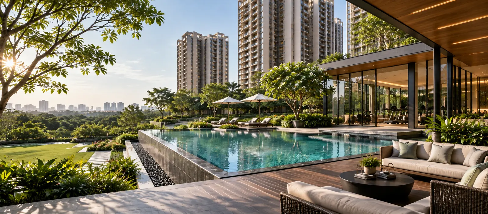 Infinity pool with timber deck, loungers and outdoor seating overlooking landscaped greenery