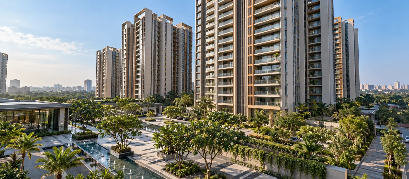 Residential towers overlooking a landscaped plaza with palm trees, water channels and walkways