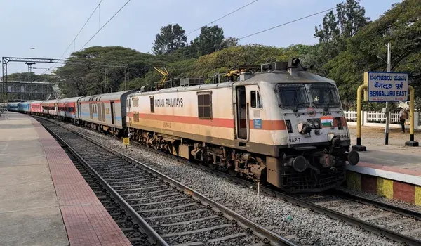 Passenger train standing at an Indian railway station platform