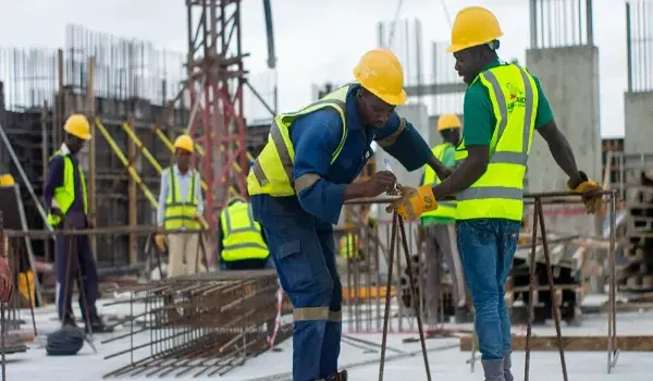 Site engineers reviewing drawings on a reinforced concrete construction site